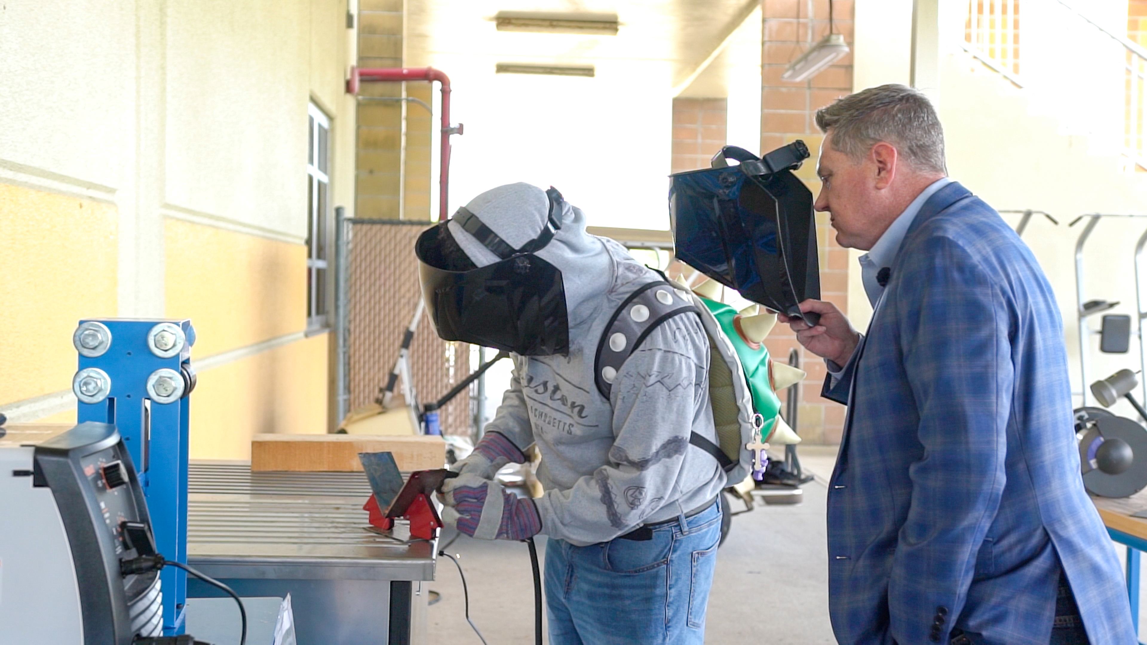 Liberty High School student and Osceola County Commission Chair Brandon Arrington in Liberty's new Career and Technical Education Manufacturing Lab, which was paid for by Osceola County Board of County Commissioners